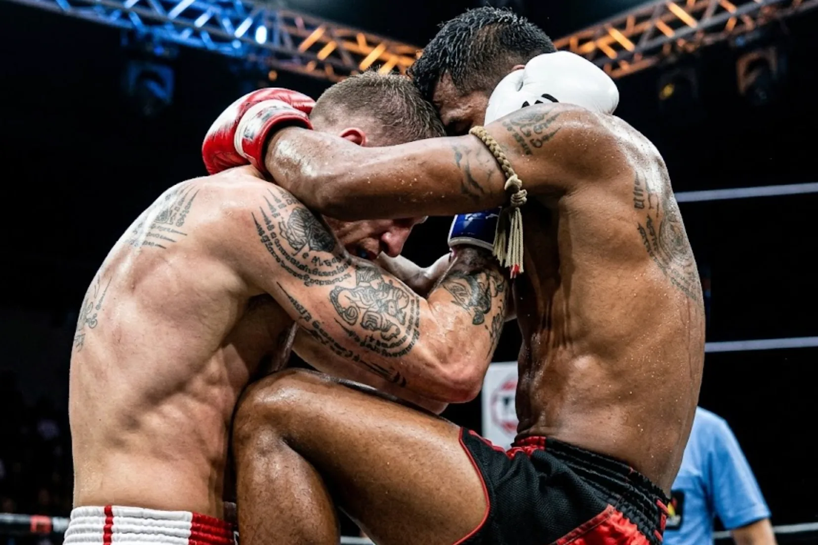 Two Muay Thai fighters working the clinch