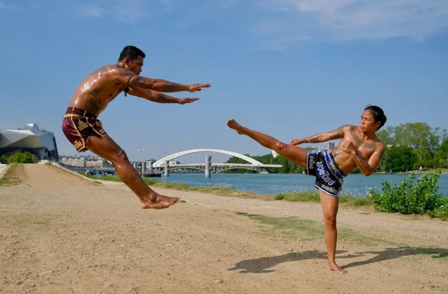 Muay Thai fighter throwing a powerful roundhouse kick in training