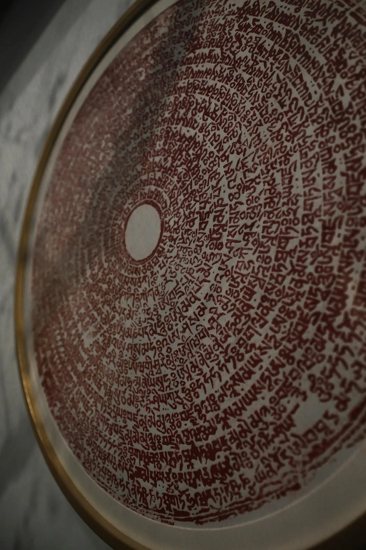 Circular Thai yantra script inscribed on a plate