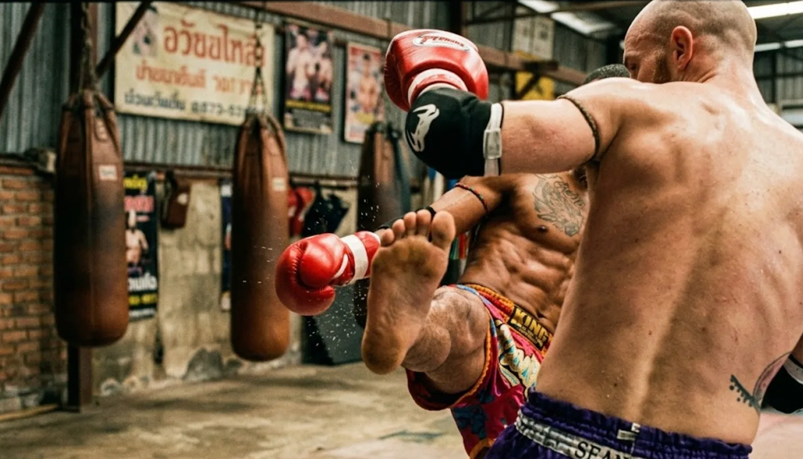 Muay Thai fighter throwing a teep in training