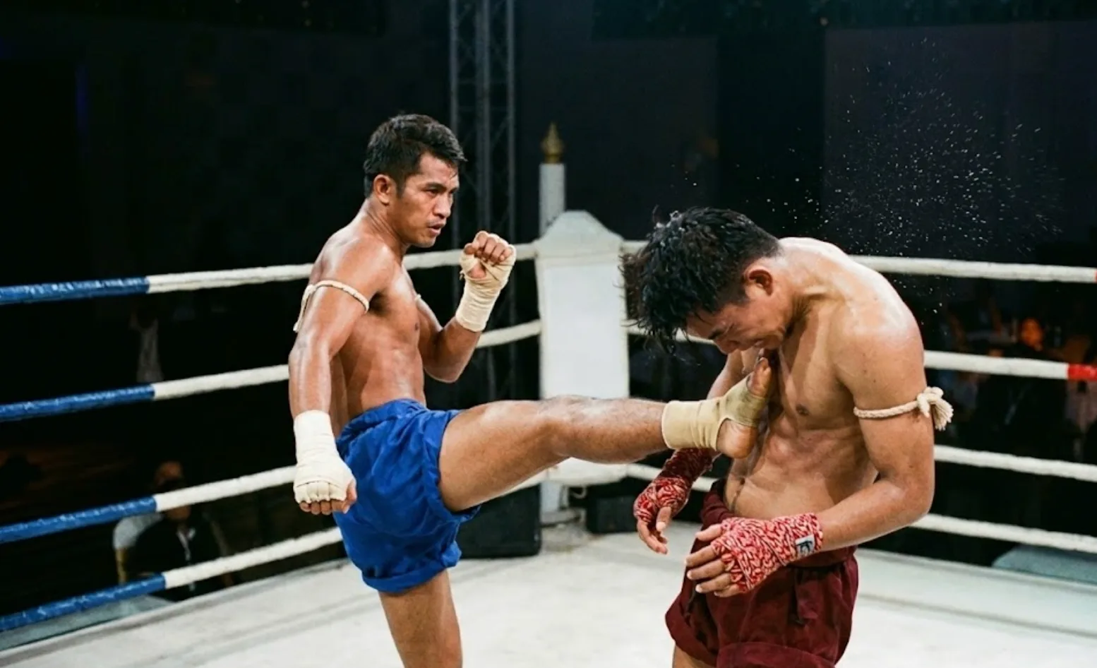 Muay Thai fighter throwing a teep push kick in training