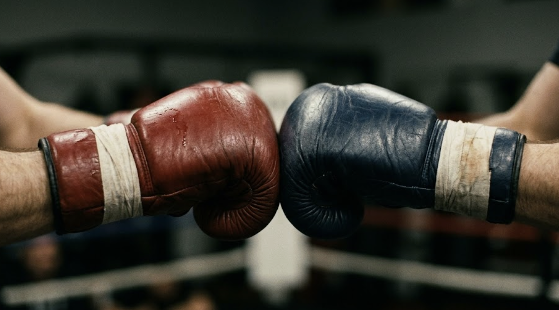 Two Muay Thai gloves touching together