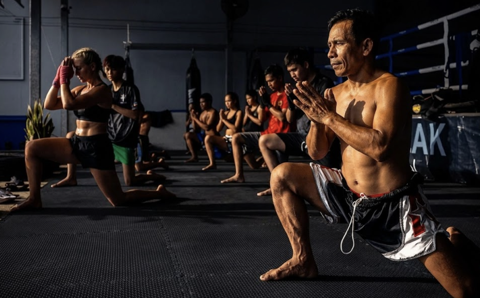 Muay Thai fighter performing the Wai Kru Ram Muay in the ring